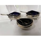 TWO MATCHING HALLMARKED SILVER SALTS WITH BLUE LINERS WITH THREE MATCHING SPOONS AND ONE OTHER