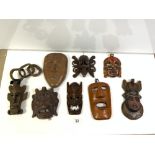 SIX CARVED WOODEN TRIBAL MASKS.