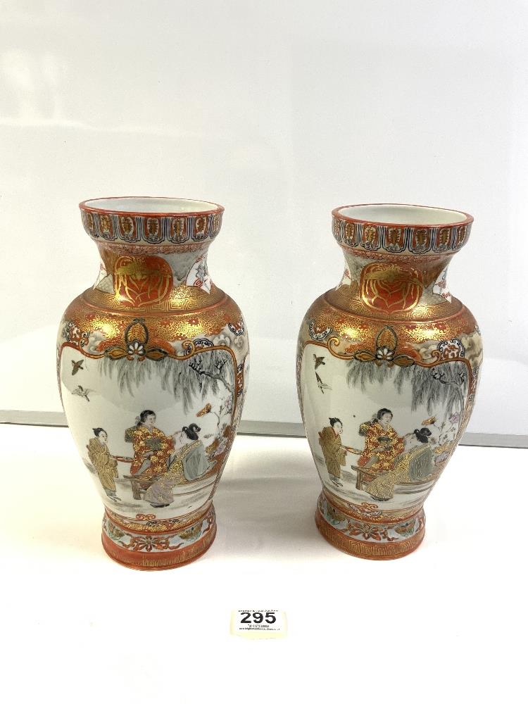 A PAIR OF EARLY 20 CENTURY JAPANESE KUTANI VASES, DECORATED WITH FIGURES, BIRDS AND FLOWERS. 32