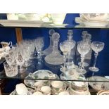 A QUANTITY OF CUT GLASS WINE, PORT, CHAMPAGNE, AND OTHER GLASSES, AND FIVE DECANTERS.