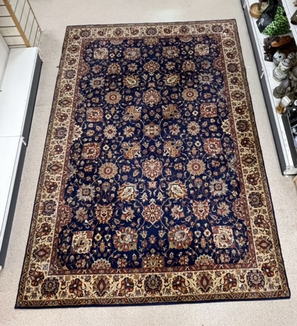 A KASHAN BLUE, RED AND CREAM PATTERNED CARPET, 250X360 CMS.