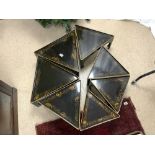 ORIENTAL BLACK AND GOLD LACQUER NEST OF SEVEN TRIANGULAR TABLES, 50 CM.