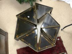 ORIENTAL BLACK AND GOLD LACQUER NEST OF SEVEN TRIANGULAR TABLES, 50 CM.