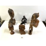 FOUR CARVED WOODEN AFRICAN BUSTS, 30 CMS TALLEST, AND TWO FIGURES.