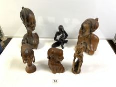 FOUR CARVED WOODEN AFRICAN BUSTS, 30 CMS TALLEST, AND TWO FIGURES.