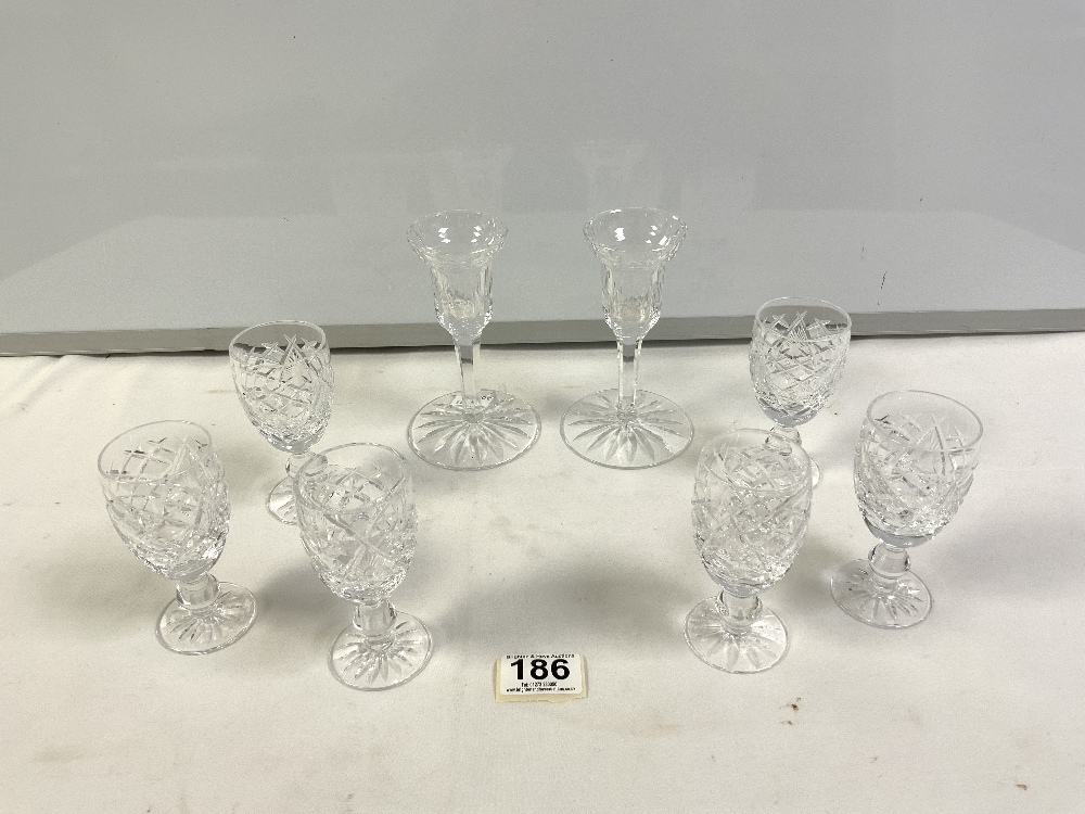 PAIR OF WATERFORD CUT GLASS TULIP SHAPED CANDLESTICKS, 14CMS, AND SET OF SIX WATERFORD CUT SHERRY