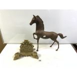 ORNATE BRASS DOUBLE INKSTAND/LETTER RACK, AND A BRASS FIGURE OF A PRANCING HORSE, 44CMS.