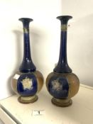 A PAIR OF OF ROYAL DOULTON STONEWARE BLUE, GREEN, AND BROWN GLAZED BOTTLE SHAPE VASES. 29 CMS.