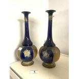 A PAIR OF OF ROYAL DOULTON STONEWARE BLUE, GREEN, AND BROWN GLAZED BOTTLE SHAPE VASES. 29 CMS.