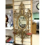 A NINETEENTH CENTURY ORNATE GILTWOOD AND GESSO GIRONDOLE WALL MIRROR, WITH CHERUB, PHEONIX, SWAG AND