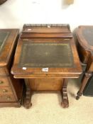 A LATE VICTORIAN INLAID MAHOGANY DAVENPOR TWITH TOOLED GREEN LEATHER TOP AND BRASS GALLERY.