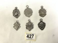 SIX HALLMARKED SILVER FOBS DATED 1908 ONWARDS
