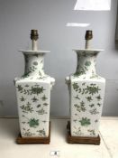 A PAIR OF CHINESE VASE LAMPS WITH FLOWER AND BIRD DECORATION, ON SQUARE WOODEN BASES. 39CMS.