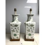 A PAIR OF CHINESE VASE LAMPS WITH FLOWER AND BIRD DECORATION, ON SQUARE WOODEN BASES. 39CMS.