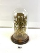 A HERMLE BRASS SKELETON CLOCK-GOTHIC CATHEDRAL DESIGN, UNDER GLASS DOME.