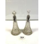 A PAIR OF HALLMARKED SIVER MOUNTED CUT GLASS SCENT BOTTLES, [ 1 WRONG STOPPER. ] 16 CMS.