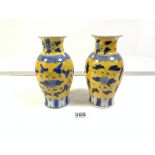 A PAIR OF CHINESE YELLOW AND BLUE FLORAL DECORATED VASES, 20 CMS.