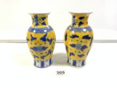 A PAIR OF CHINESE YELLOW AND BLUE FLORAL DECORATED VASES, 20 CMS.