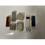 TWO SILVER PLATED VESTAS, FOUR LIGHTERS VARIOUS AND A PILL BOX.