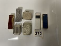 TWO SILVER PLATED VESTAS, FOUR LIGHTERS VARIOUS AND A PILL BOX.