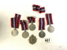 FIVE BRITISH WAR MEDALS AND RIBBONS 1939-45 WITH A WW2 THE BORDER REGIMENT CAP BADGE