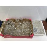 A QUANTITY OF CUT AND MOULDED GLASS WINE GLASSES, CHAMPAGNE FLUTES ETC.