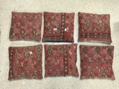 SIX CARPET CUSHIONS