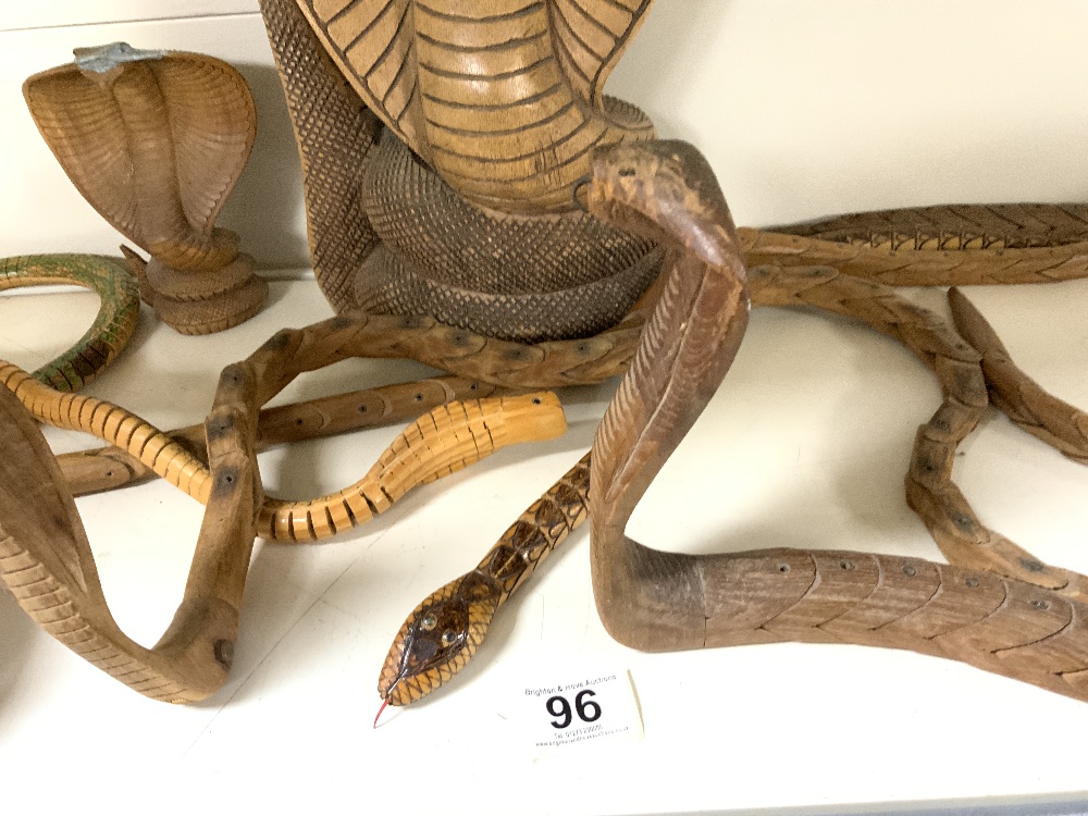 A CARVED WOODEN FIGURE OF A COBRA, AND THREE CARVED ARTICULATED WOODEN COBRAS. - Image 4 of 4