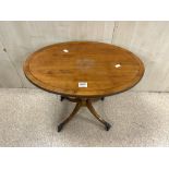 VINTAGE OVAL TABLE WITH BRASS LION PAW FEET ON CASTORS 67 X 46 X 53 CMS