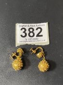 A PAIR OF ORNATE YELLOW METAL EASTERN DESIGN EARINGS. 8.4 GRAMS.