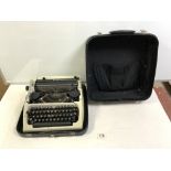 A VINTAGE ROBOTRON PORTABLE TYPEWRITER, WITH CASE.