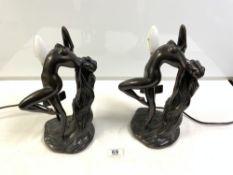 A PAIR OF PLASTER BRONZE EFFECT ART DECO STYLE FEMALE FIGURAL TABLE LAMPS. 33CMS.