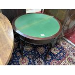 A DEMI LUNE MAHOGANY FOLDING TOP CARD TABLE ON BALL AND CLAW FEET, WITH GREEN BAIZE, 76 CMS OPEN.