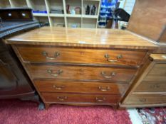 A REGENCY INLAID MAHOGANY CHEST OF FOUR GRADUATING DRAWERS, WITH BRASS SWAN NECK HANDLES ON SPLAY