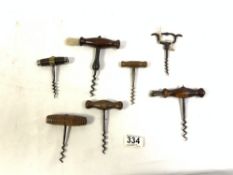 ANTIQUE STEEL BRASS AND MAHOGANY CORK SCREW BY LB PARIS, AND SIX OTHER ANTIQUE CORK SCREWS.