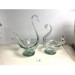TWO GREEN GLASS SWAN SHAPED BOWLS. 30CMS TALLEST.