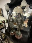 A PAIR OF VICTORIAN SPELTER CAVALIER FIGURE TABLE LAMPS WITH FLAME GLASS SHADES, 70 CMS.