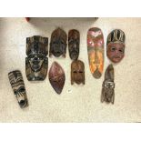 QUANTITY OF TRIBAL AFRICAN WALL MASKS; LARGEST 55CM