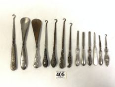 A QUANTITY OF SILVER HANDLE AND OTHER BUTTON HOOKS AND TWO FILES