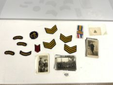 A QUANTITY OF 1ST WORLD WAR PHOTOGRAPHIC POSTCARDS, THREE MEDAL RIBBONS AND CLOTH PATCHES,