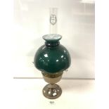 A VINTAGE ALADDIN BRASS OIL LAMP WITH GREEN GLASS SHADE.