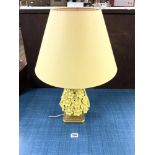 A YELLOW CERAMIC FLORAL ENCRUSTED TABLE LAMP, [A/F], 30 CMS.