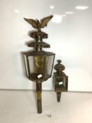 TWO ANTIQUE BRASS COACHING LAMPS, ONE WITH EAGLE MOUNT.