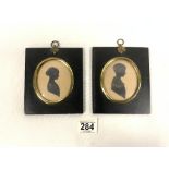 A PAIR OF NINETEENTH CENTURY SILHOUETTES OF BOY AND GIRL; FRAMED.