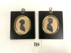 A PAIR OF NINETEENTH CENTURY SILHOUETTES OF BOY AND GIRL; FRAMED.