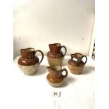 FOUR ANTIQUE STONEWARE HARVEST JUGS. 17CMS.