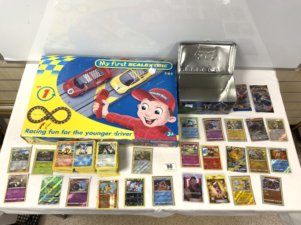 A BOXED MY FIRST SCALEXTRIC SET, AND QUANTITY OF POKEMON CARDS.