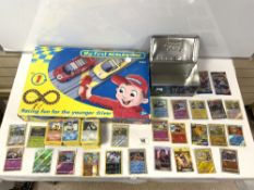 A BOXED MY FIRST SCALEXTRIC SET, AND QUANTITY OF POKEMON CARDS.