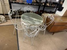 ORNATE WROUGHT IRON CIRCULAR GLASS TOP GARDEN TABLE AND FOUR MATCHING CHAIRS, 80 CMS DIAMETER.