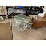 ORNATE WROUGHT IRON CIRCULAR GLASS TOP GARDEN TABLE AND FOUR MATCHING CHAIRS, 80 CMS DIAMETER.